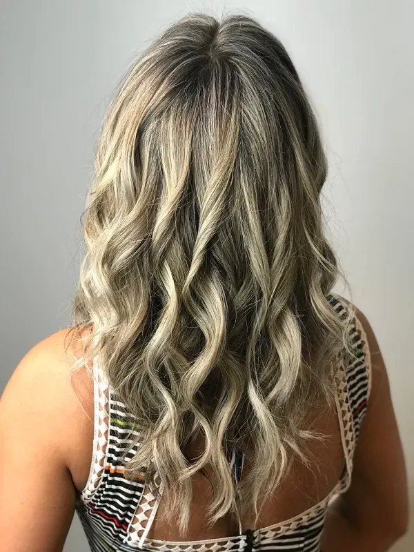 Blonde balayage hand painted down the back and set in loose waves