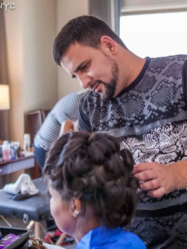 A bridal updo being pinned in the getting ready room