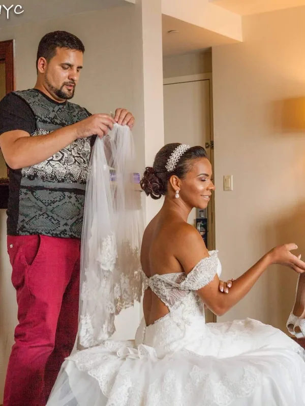 Bridal updo with a crystal band, the veil going on