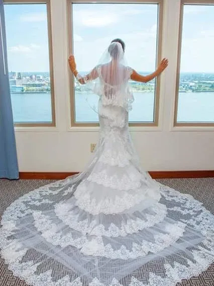 Bridal veil and cathedral train laid out at the window