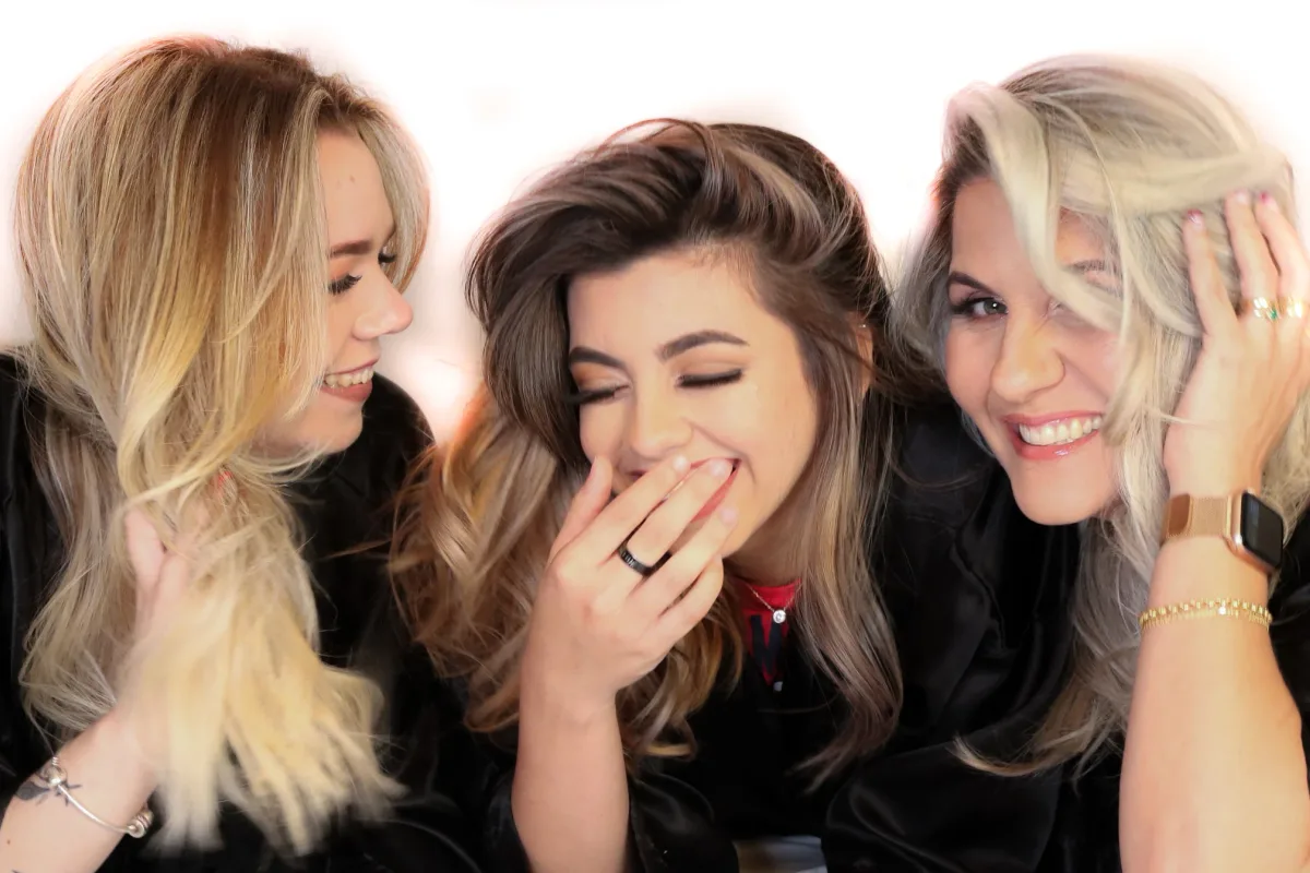 Three clients from the same color session, one warm blonde, one bronde and one silver