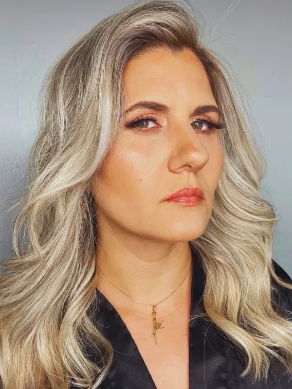 Full highlights taken cool and silver, worn long and set in a deep side wave